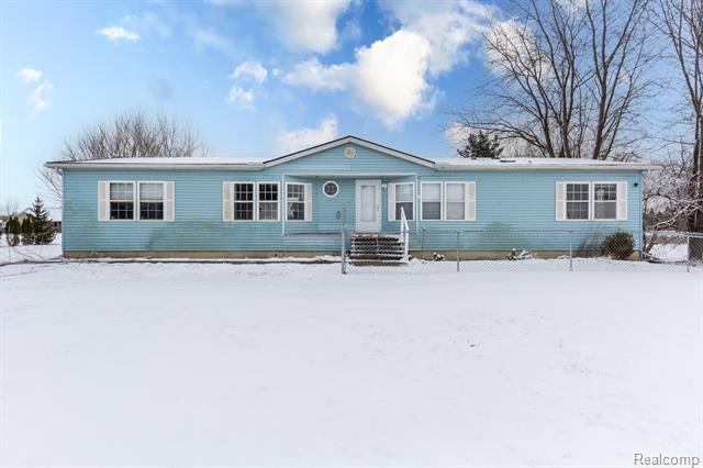 front view picture of 69288 Omo Rd, Richmond, MI. 48062