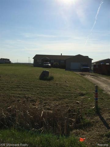 front view picture of 78037 Deland Rd, Richmond, MI. 48062