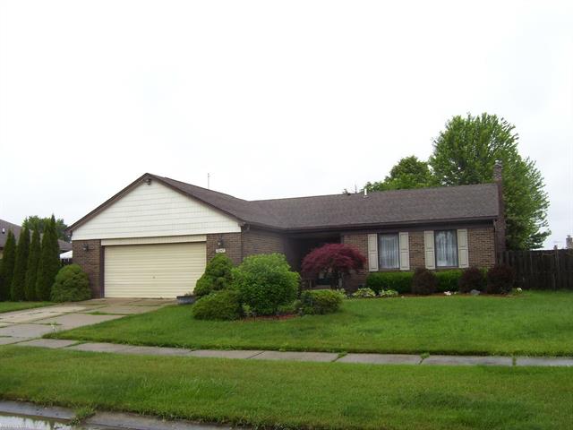 front view picture of 16447 Woodstream, Clinton Township, MI. 48038