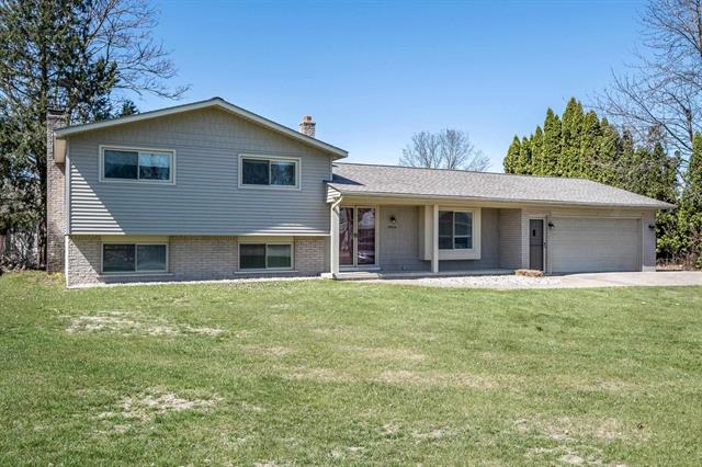front view picture of 49225 Romeo Plank Rd, Macomb, MI. 48044