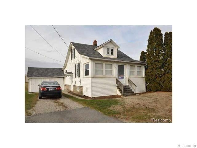front view picture of 50811 Romeo Plank Rd, Macomb, MI. 48044