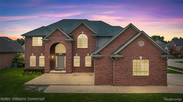 front view picture of 55257 Breton Woods Dr, Macomb, MI. 48042