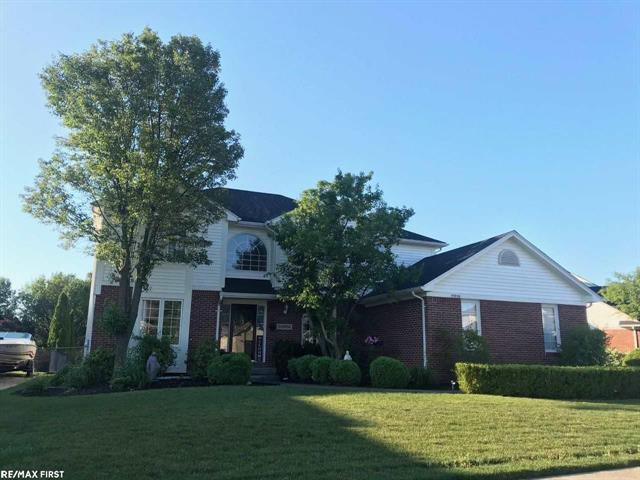 front view picture of 55856 Serene Dr, Macomb, MI. 48042