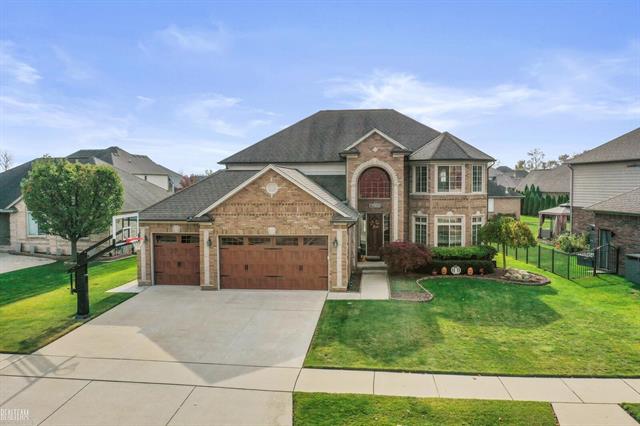 front view picture of 16258 Bishopsgate Dr, Macomb, MI. 48044
