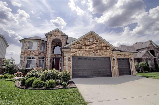 front view picture of 19330 Middle Branch Dr, Macomb, MI. 48044
