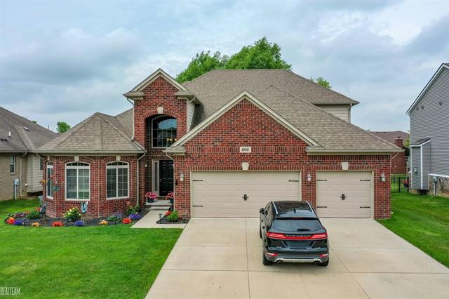 front view picture of 49061 Mustang Dr, Macomb, MI. 48042