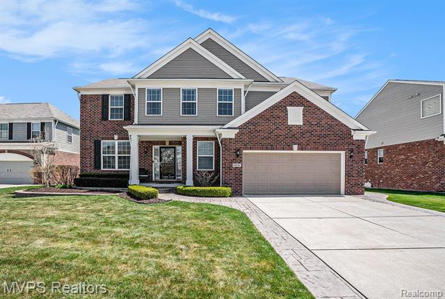 front view picture of 49218 Camarosa Ln, Macomb, MI. 48044