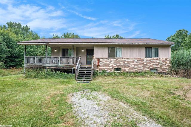 front view picture of 7758 Puttygut Rd, Casco, MI. 48064
