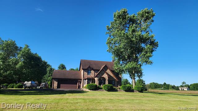 front view picture of 12923 Belle River Rd, Memphis, MI. 48041