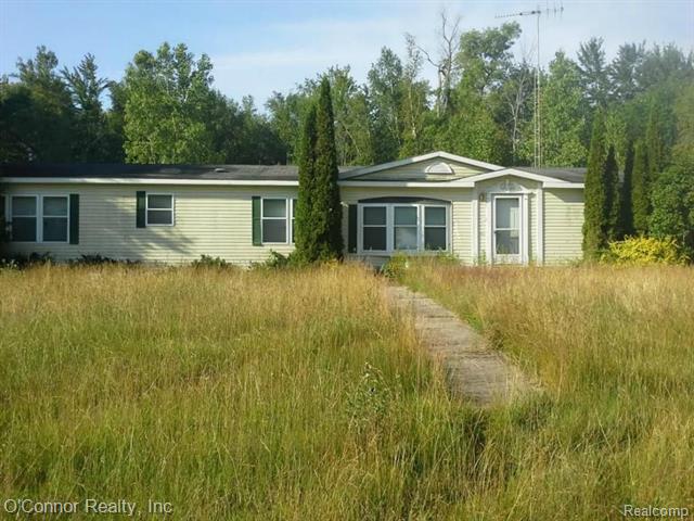 front view picture of 8067 Lambs Rd, Goodells, MI. 48027