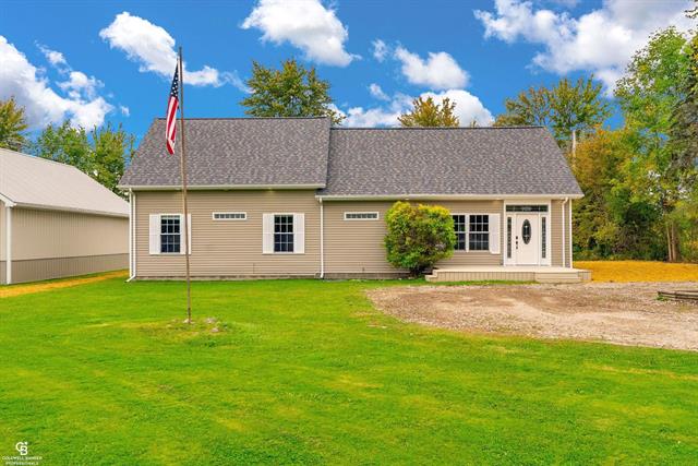 front view picture of 10643 Brandon Rd, Emmett, MI. 48022