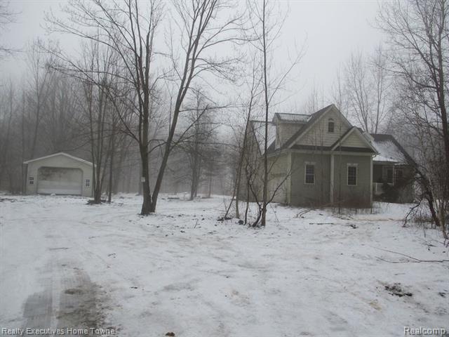 front view picture of 11294 Rose Rd, Emmett, MI. 48022