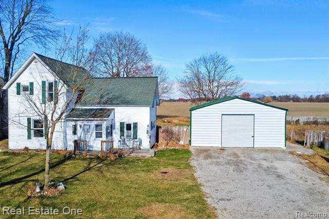 front view picture of 7560 Metcalf Rd, Avoca, MI. 48006